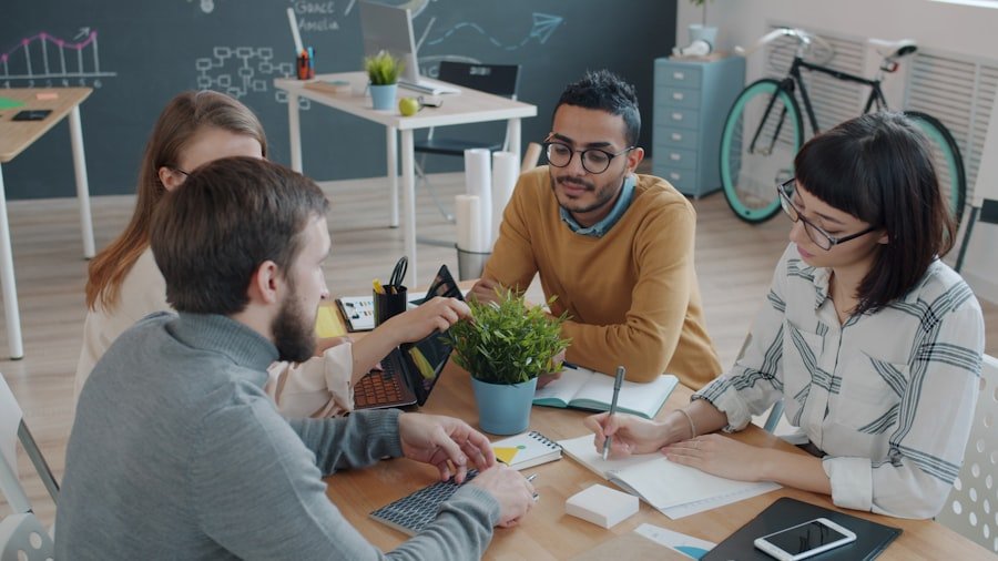 A team collaborating around a table, representing the staffed execution behind the Scale Partnership
